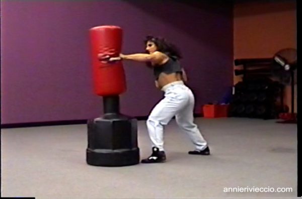Annie Rivieccio, muscular, female bodybuilder, punching bag, gym workout, pecs, squats, muscular legs