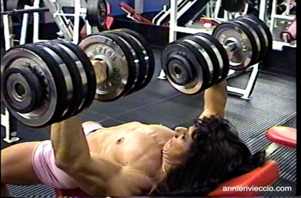 Annie Rivieccio, muscular, female bodybuilder, punching bag, gym workout, pecs, squats, muscular legs